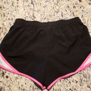 Black and pink athletic shorts